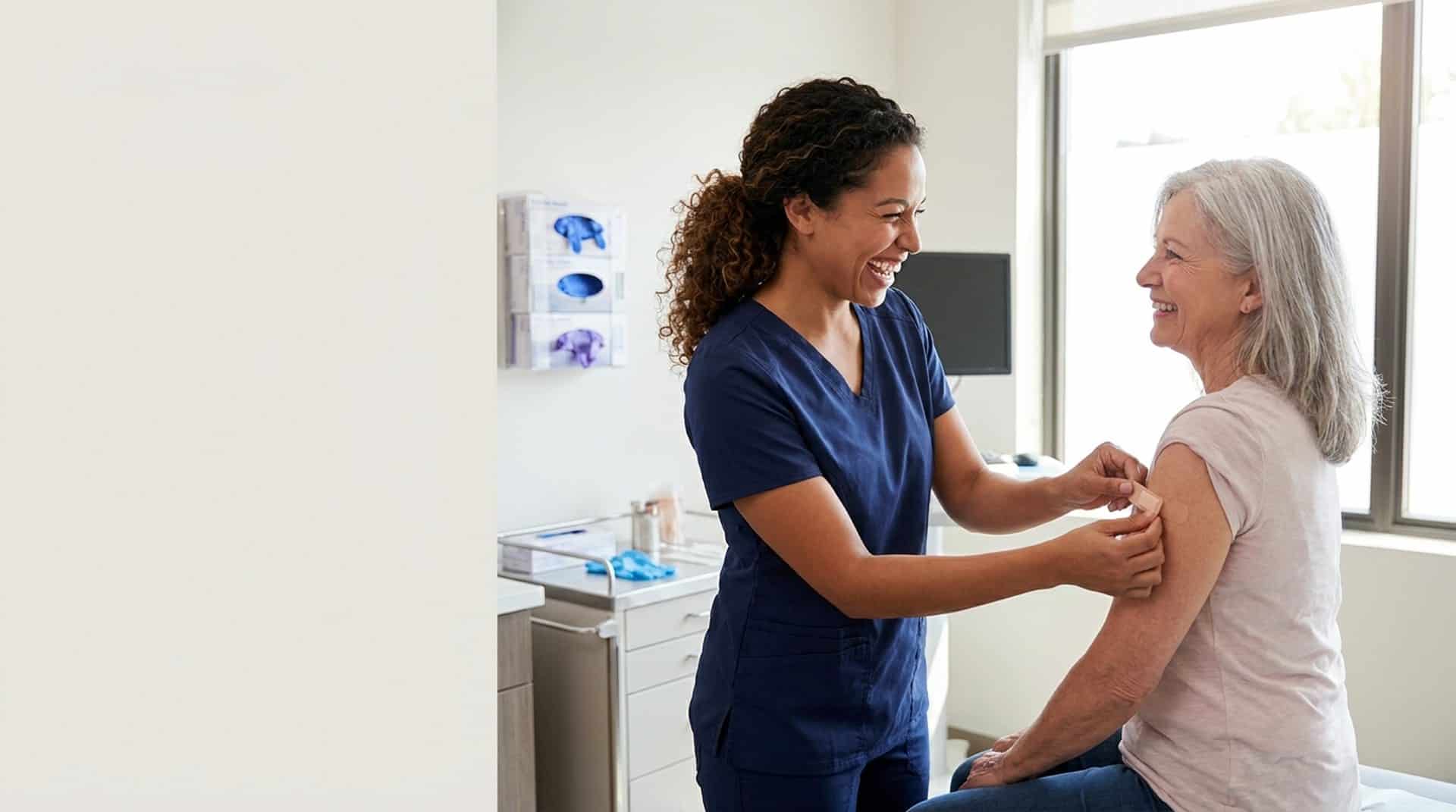 Medical assistant caring for a patient in a clinic