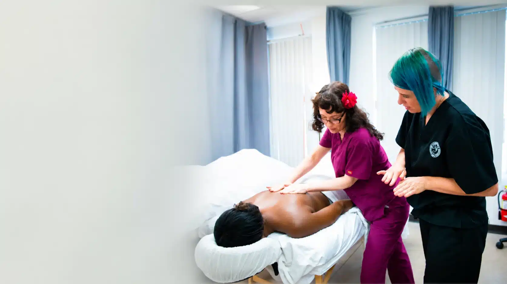 Therapist assisting a patient with shoulder mobility work