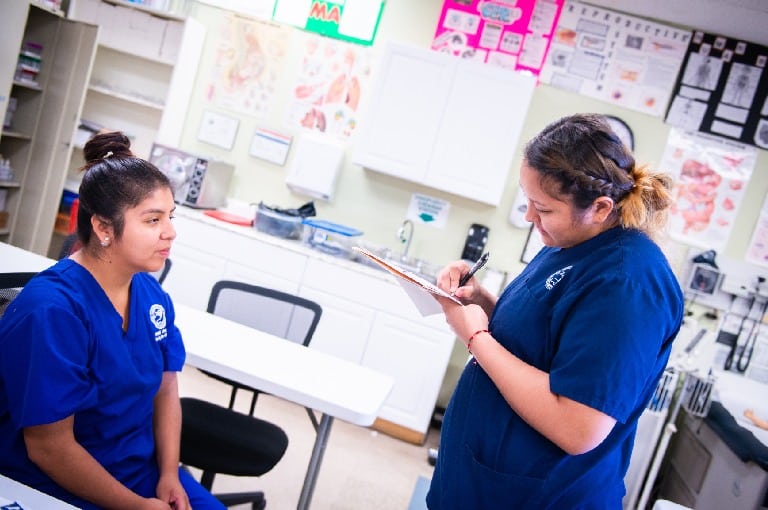 Lab partners practicing clinical skills